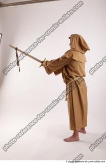 04 2018 01 PAVEL MONK STANDING POSE WITH SWORD AND…